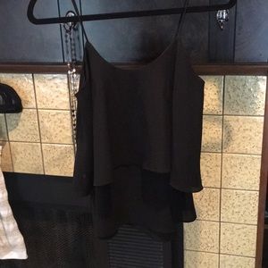 Black strappy tank size small. Fits long